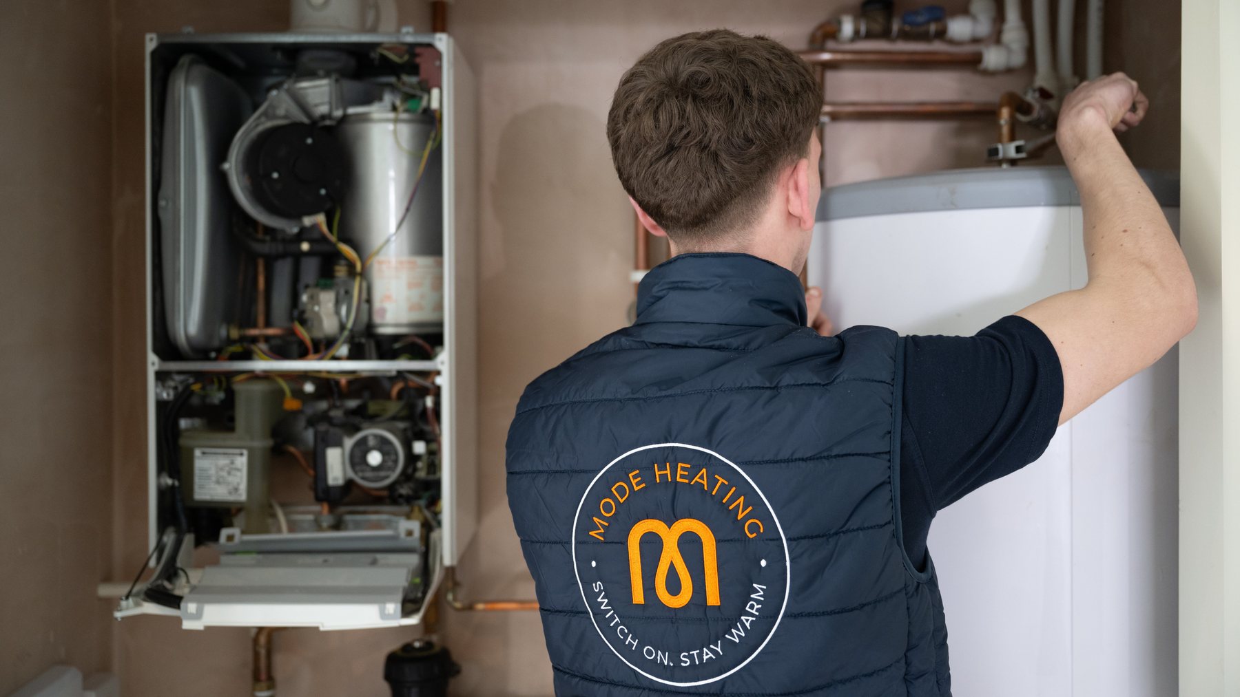 An engineer at work on a boiler installation
