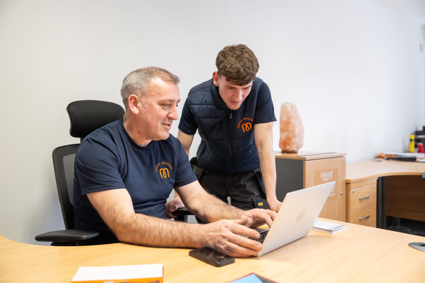 Two team members planning work together in the office